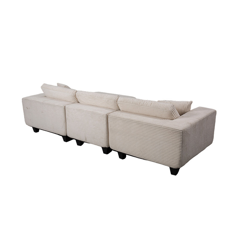 Sofá esquinero grande en forma de L de pana color blanquecino con diseño minimalista moderno Sofá esquinero grande en forma de L de pana color blanquecino con diseño minimalista moderno